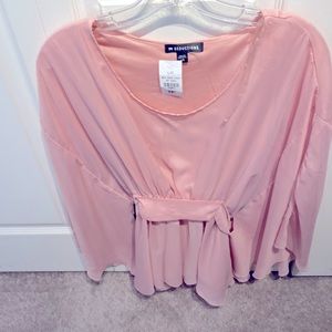 A top from seduction collection coral in colour and large size